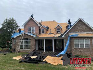 back side of roof begins installation of roofing components
