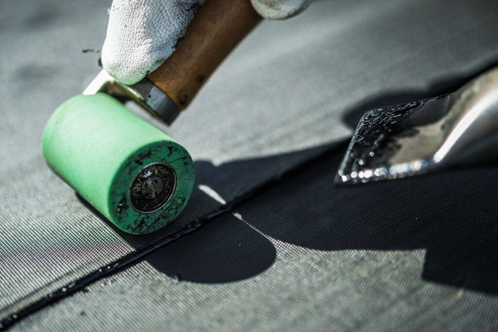 commercial roof coating types, best commercial roof coating, commercial roof sealant, elastomeric roof coating, silicone roof coating cost, roof coating vs replacement, commercial roof maintenance, Knoxville commercial roofing, roof coating lifespan, reflective roof coating, TPO roof coating, spray-on roof coating, flat roof sealant, best roof coating for metal, commercial roofing Knoxville TN