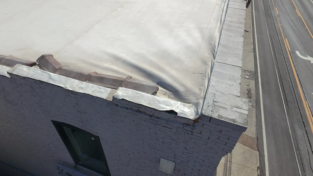 commercial wall cap replacement knoxville, wall cap replacement near me, commercial roof wall cap, parapet wall cap replacement, commercial roof edge repair, knoxville commercial roofing, metal wall cap replacement, commercial roof leak prevention, roof edge metal knoxville, wall cap contractor knoxville, commercial roof maintenance tn, commercial roofing knoxville tn, storm damage roof edge, parapet wall repair commercial, roof edge replacement tn