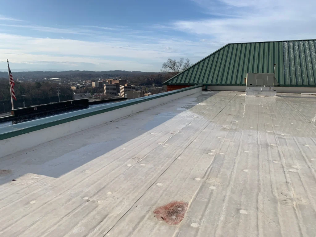 commercial wall cap replacement knoxville, wall cap replacement near me, commercial roof wall cap, parapet wall cap replacement, commercial roof edge repair, knoxville commercial roofing, metal wall cap replacement, commercial roof leak prevention, roof edge metal knoxville, wall cap contractor knoxville, commercial roof maintenance tn, commercial roofing knoxville tn, storm damage roof edge, parapet wall repair commercial, roof edge replacement tn