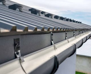 HOW MUCH SHOULD A NEW ROOF AND GUTTERS COST?