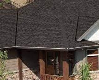 Should I use builder's grade shingles when re-roofing my home?
